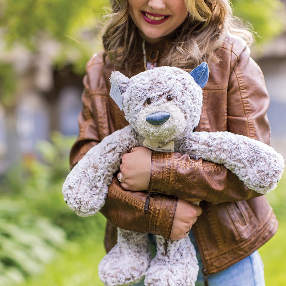 Anna holding a teddy bear.