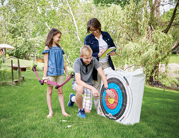 Kim Wilson’s kids learn by experiencing, including unique activities like archery. 