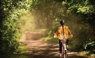 A girl biking in Carver Lake Park