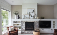 A fireplace decorated by Twigg + Lu in a home designed by Ispiri.
