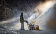 Manjinder Kaur’s husband snowblows their Woodbury driveway.