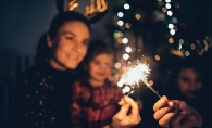 A family celebrates New Year's Eve at home.