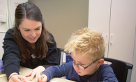 A Family Achievement Center therapist works with a young client.