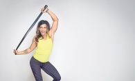 UrbanIRON Fitness kettlebell training UrbanIRON Fitness owner Dena Smith works out with an exercise band.