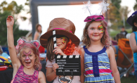 A group of young girls pose for a photo at Starlight Cinema, Woodbury's outdoor summer movie event.