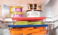 A variety of healthy foods in Tupperware.