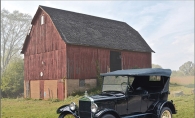 An antique Model T sits in front of the historic Miller Barn in Woodbury.