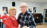 Two seniors dance at an event at DPC Community Center.