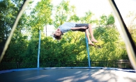 Child flipping on trampoline