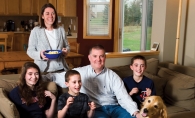 Chip and Amy Scoggins at home with their children: Megan , Joe and Spencer and dog Rosie. 
