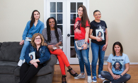 Sheletta Brundidge of the Two Haute Mamas WCCO Radio podcast poses with her book club, who read Michelle Obama's "Becoming"
