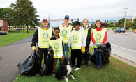 The Woodbury Rotary Club cleans up garbage.
