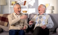Older gentlemen laughing while having lively discussion