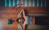 A woman works out at home.