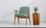 Two pieces of sustainable furniture - a chair and a side table - in a living room.