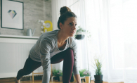 A woman does yoga as part of her fitness plan.