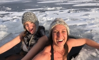 Two woman cold water plunging.