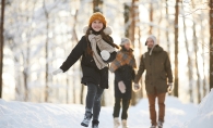 Family walking in winter woods.