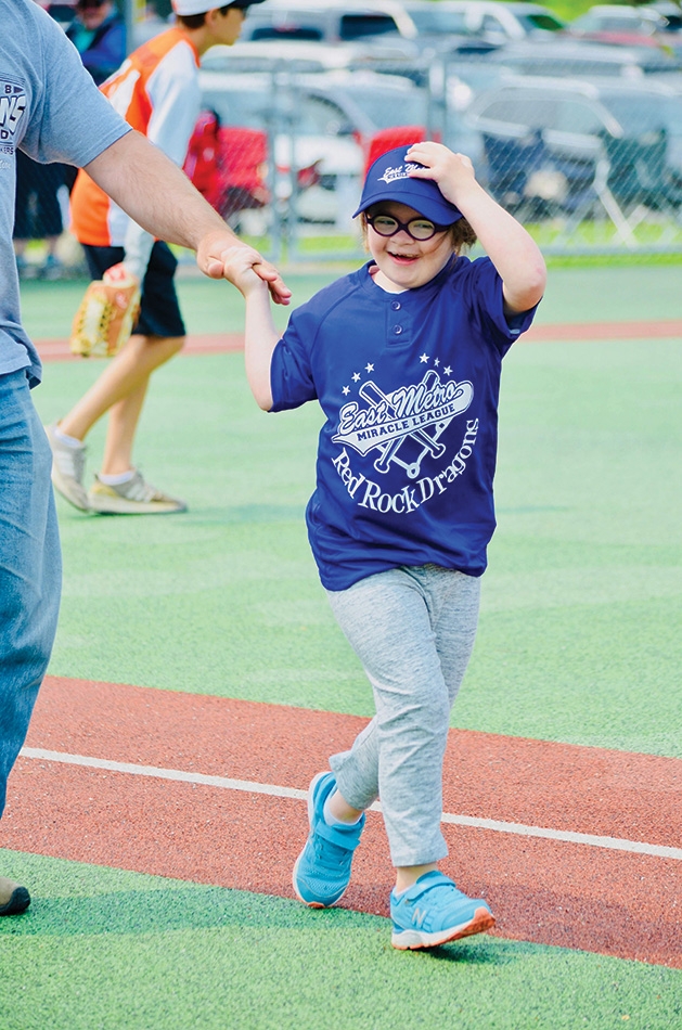 A player runs the bases at an East Metro Miracle League game