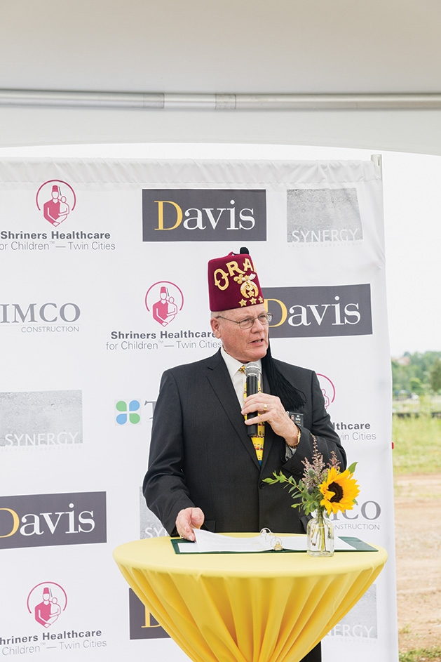 A man speaks at the Shriners Healthcare for Children groundbreaking in Woodbury.