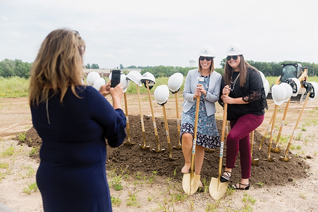 Two women pose for a photo at the Shriners Healthcare for Children groundbreaking in Woodbury
