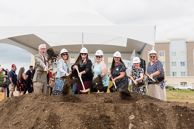 Several people break ground at the Shriners Healthcare for Children clinic in Woodbury