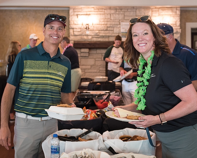 Travis and Tonya Holt at the Woodbury Area Chamber of Commerce golf tournament.