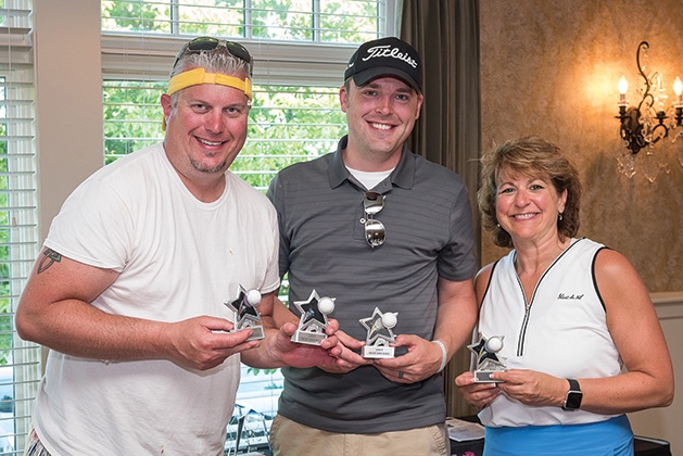 Brian Griffith, Joe Ackerland and Carol Maloney at the 33rd annual Woodbury Area Chamber of Commerce golf tournament.