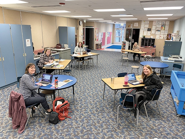 South Washington County Schools teachers smile for the camera.