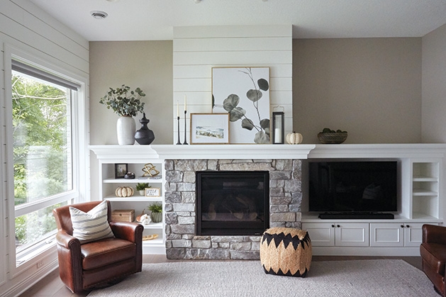 A fireplace decorated by Twigg + Lu in a home designed by Ispiri.