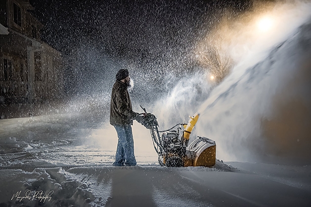 Manjinder Kaur’s husband snowblows their Woodbury driveway.