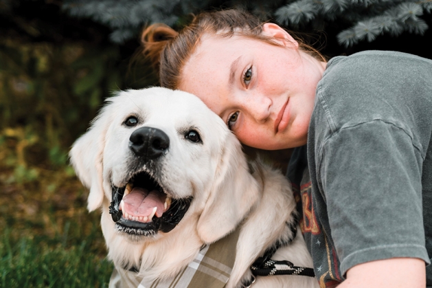 Teen Emerson Tallents and service dog Arlo.