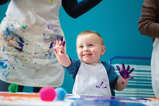 Child having fun painting at Kidcreate Studio.