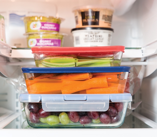 A variety of healthy foods in Tupperware.