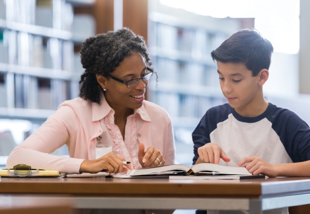 A woman tutors a boy at Sylvan Learning Center.