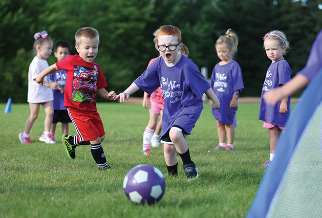 A group of kids play soccer through Woodbury Parks & Recreation, voted Best Place for Kids' Activities in the Best of Woodbury 2019 readers' choice survey.