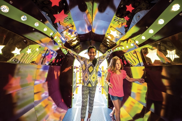 Kids play at a colorful playground