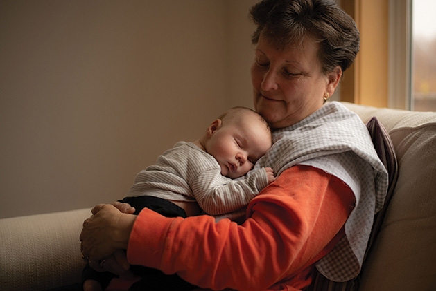 A grandmother holds her grandson in this Focus on Woodbury winning photo