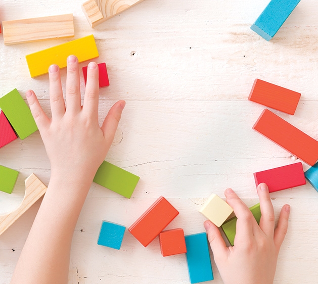 A child plays with blocks