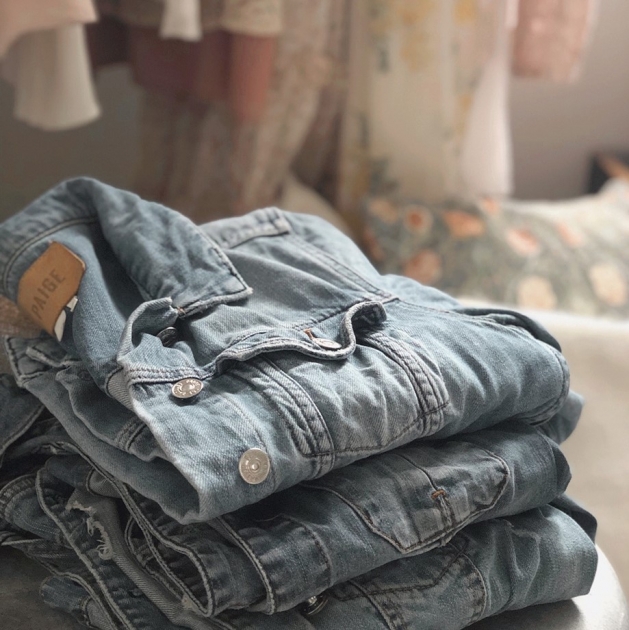 Folded pile of jean jackets