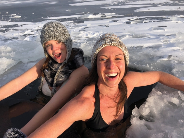 Two woman cold water plunging.