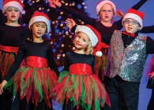 Children sing and dance during Aspire Music Academy's Holiday Spectacular.