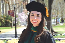 Jessica Ulrich wears a cap and gown and graduation day.