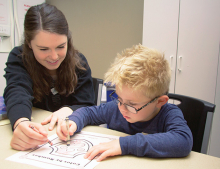 A Family Achievement Center therapist works with a young client.