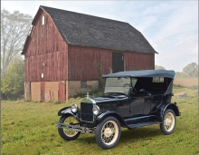 An antique Model T sits in front of the historic Miller Barn in Woodbury.