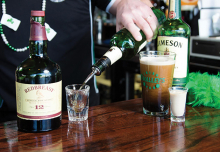 A bartender at O'Malley's Irish Pub, a finalist for best tavern/bar/brewery in the Best of Woodbury 2019 readers' choice survey, pours a shot of Jameson Irish whiskey. A freshly-poured Guiness sits nearby.