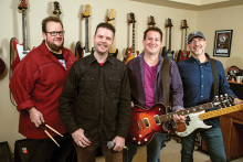 Members of the rock band Capital Sons pose with their instruments.