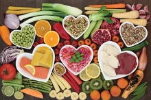 A spread of heart healthy foods, arranged in hearts.