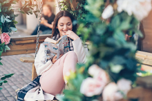 A woman reads a book on her newly remodeled patio.