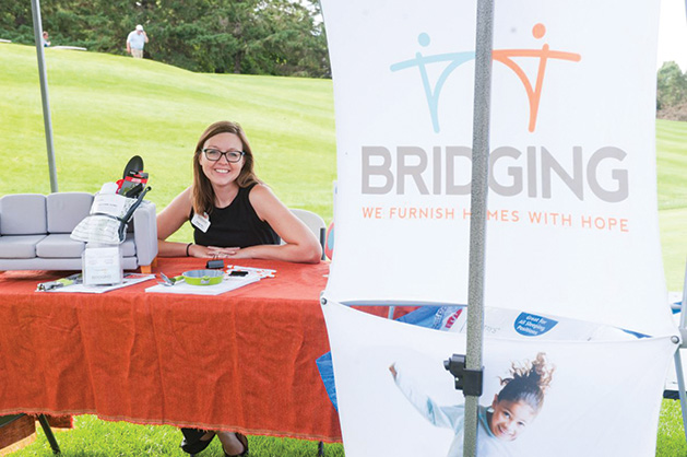 A woman from Bridging at a charity event.